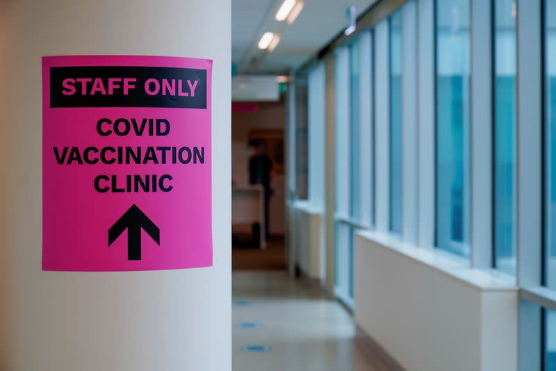 FILE PHOTO: A sign for a COVID-19 vaccination clinic is seen in Melbourne