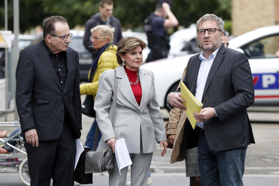American lawyer Gloria Allred, center, and French lawyer, Jean Marc Descoubes, right, arrive to give a press conference, in Paris, Tuesday, May 28, 2019. The lawyer for a woman who filed a rape complaint in Paris against Chris Brown says the American rap artist "has thumbed his nose at and shown disrespect for the French legal system" after he did not attend a confrontation with the alleged victim Tuesday. (AP Photo/Thibault Camus)