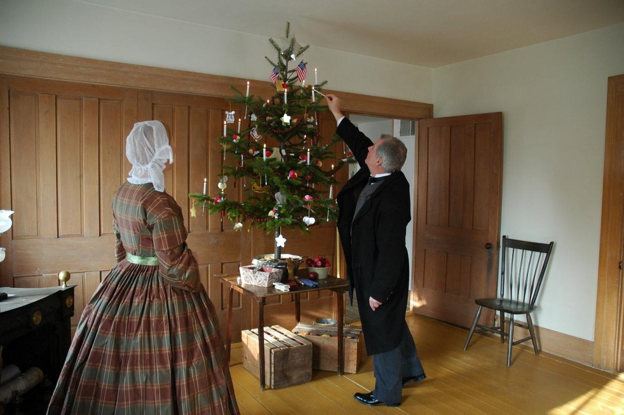 Costumed staff will light the Christmas tree in the Wade House.