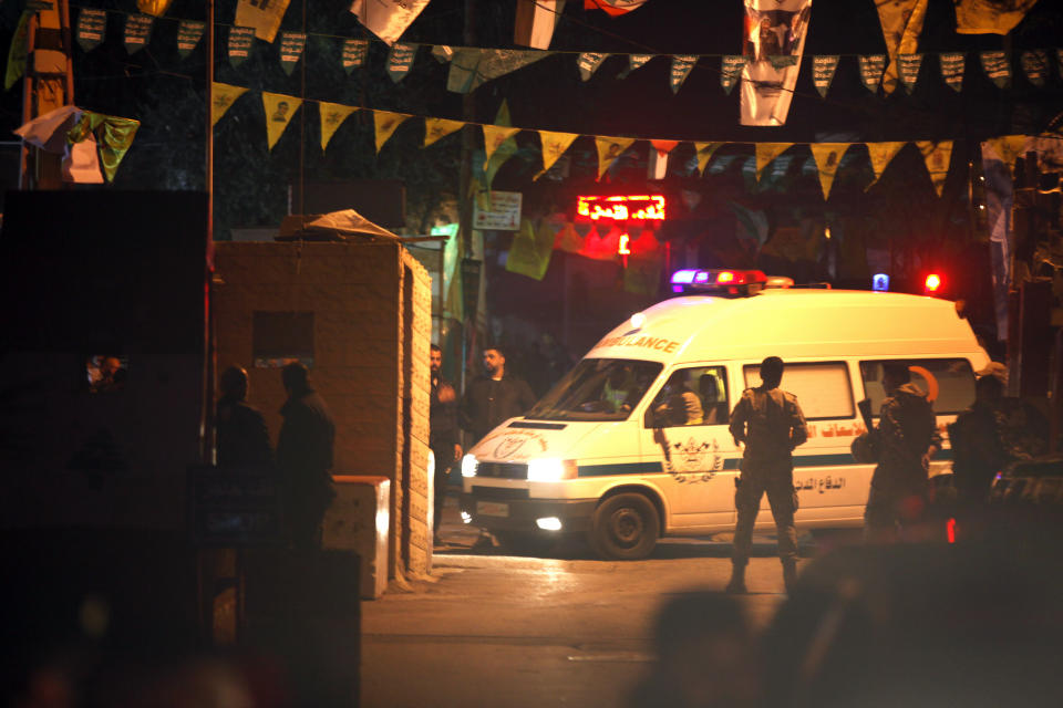 An ambulance enters the Burj Shamali Palestinian refugee camp, in the southern port city of Tyre, Lebanon, Friday, Dec. 10, 2021. Arms stored for the Palestinian Hamas group exploded in a refugee camp in southern Lebanon on Friday night, killing and wounding a number of people, the state-run National News Agency reported. (AP Photo/Mohammed Zaatari)