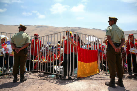 Policemen patrol as Pope Francis celebrates a Mass at Lobito beach in Iquique, Chile, January 18, 2018. REUTERS/Alessandro Bianchi