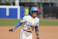 UCLA's Savannah Pola (5) celebrates after a hit to bring in three runs to win the game against Florida during an NCAA softball Women's College World Series game on Sunday, June 5, 2022, in Oklahoma City. (AP Photo/Alonzo Adams)