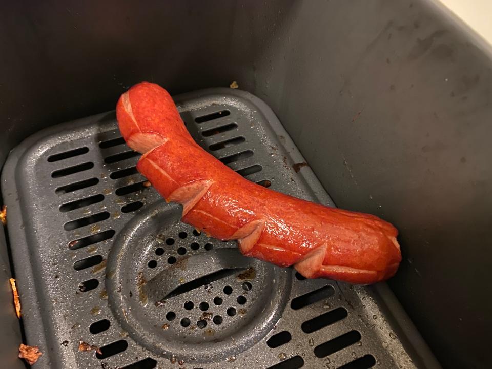 Hot dog in an air fryer.