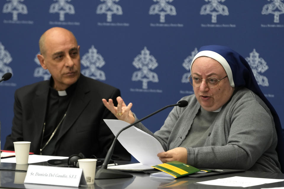 Argentine Cardinal Victor Manuel Fernandez, left, head of the Vatican doctrine office, and Sister Daniela del Gaudio, head of he Observatory on Marian Apparitions and Mystical Phenomenon, attend a press conference at the Vatican, Friday, May 17, 2024. The Vatican on Friday radically reformed its process for evaluating alleged visions of the Virgin Mary, weeping statues and other seemingly supernatural phenomena that have long punctuated church history, putting the brakes on making definitive declarations unless the event is obviously fabricated. (AP Photo/Alessandra Tarantino)