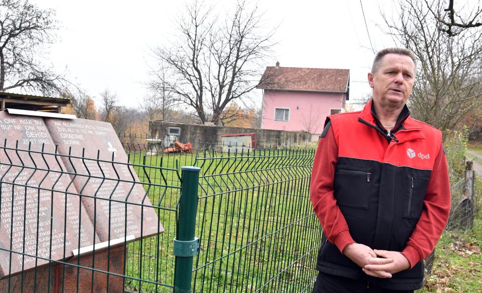 Bosnian Muslim, Fikret Bacic (59), whose wife and 2 children were executed in 1992 by Bosnian-Serb forces, stands next to the stone monument, honoring members of his family murdered on his former homestead in the village of Zecovi, near Prijedor, in Northern Bosnia, on November 20, 2017.  Apart from his wife and children, 26 of Bacic's relatives were killed including his brother and his family. Fikret Bacic, to date, remains on a mission to find remains of his beloved ones. United Nations judges on November 22, 2017 sentenced former Bosnian Serbian commander Ratko Mladic to life imprisonment after finding him guilty of genocide and war crimes in the brutal Balkans conflicts over two decades ago.    / AFP PHOTO / ELVIS BARUKCIC        (Photo credit should read ELVIS BARUKCIC/AFP via Getty Images)