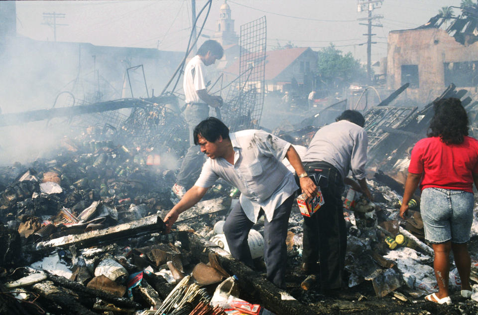 People sifting through debris