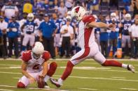 Sep 17, 2017; Indianapolis, IN, USA; Arizona Cardinals kicker Phil Dawson (4) kicks the game winning field goal while Arizona Cardinals punter Andy Lee (2) holds in overtime of the game against the Indianapolis Colts at Lucas Oil Stadium. Trevor Ruszkowski-USA TODAY Sports