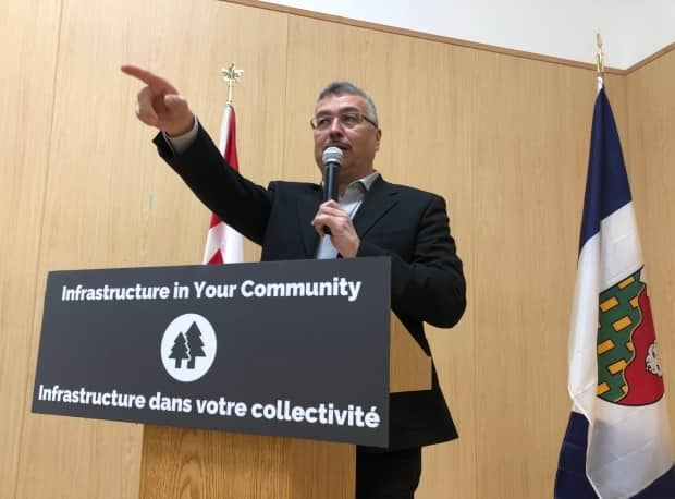 N.W.T MP Michael Michael McLeod, along with Tlicho Grand Chief George Mackenzie, announced that 18 new modular housing units would be built in the Tlicho region byt the end of the fiscal year.  (Gabriela Panza-Beltrandi/CBC - image credit)