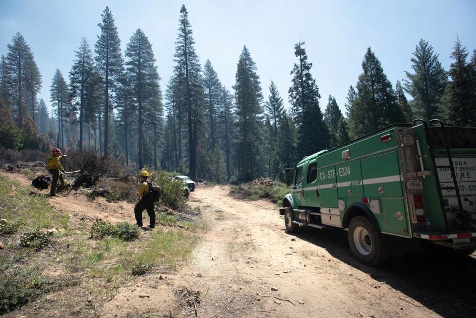 Firefighters work on a prescribed burn in the Stanislaus National Forest near Strawberry in May 2022.