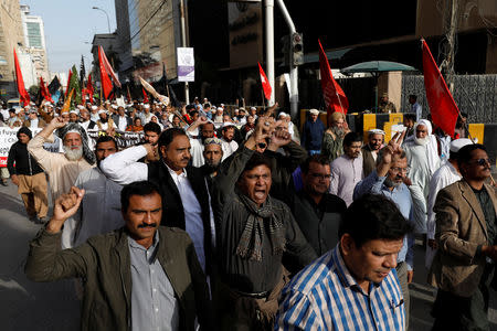 Journalists and social activists chant slogans during a rally protest which they say is against layoffs and the non-payment of salaries, in Karachi, Pakistan February 8, 2019. Picture taken February 8, 2019. REUTERS/Akhtar Soomro