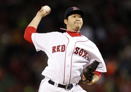 Oct 23, 2013; Boston, MA, USA; Boston Red Sox relief pitcher Junichi Tazawa (36) throws against the St. Louis Cardinals during the eighth inning of game one of the MLB baseball World Series at Fenway Park. Greg M. Cooper-USA TODAY Sports