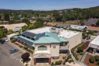 Alliance Medical Center, with solar panels mounted on the roof, is shown on Wednesday, May 29, 2024 in Healdsburg, Calif.. In May, Alliance Medical Center — which serves 13,000 patients per year, mostly underinsured and uninsured essential workers who labor in the wine country’s fields, hotels and restaurants — turned on a new rooftop solar and battery storage system. (AP Photo/Nic Coury)
