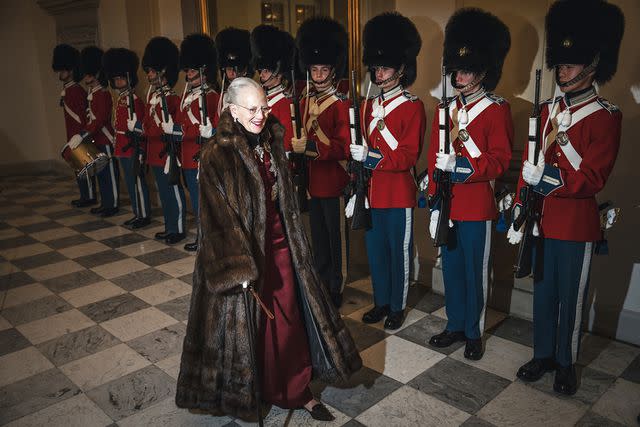 <p>Mads Claus Rasmussen/Ritzau Scanpix/AFP/Getty</p> Queen Margrethe enters the New Year's reception at Christiansborg Palace on Jan. 4.