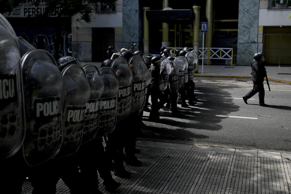 Police advance to disperse an anti-government protest against food scarcity at soup kitchens and against economic reforms proposed by President Javier Milei in Buenos Aires, Argentina, Wednesday, April 10, 2024. (AP Photo/Natacha Pisarenko)