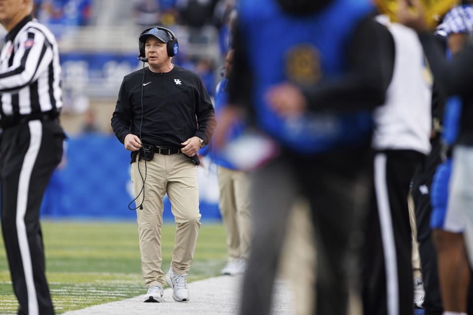 FILE - Kentucky head coach Mark Stoops looks up at the videoboard during an NCAA college football game against Louisville in Lexington, Ky., on Nov. 26, 2022. Iowa (7-5) and Kentucky (7-5) will face off on Saturday, Dec. 31, 2022, in the Music City Bowl. (AP Photo/Michael Clubb, File)