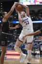 Connecticut's Katie Lou Samuelson, right, is fouled by South Carolina's Mikiah Herbert Harrigan, left, during the first half of an NCAA college basketball game, Monday, Feb. 11, 2019, in Hartford, Conn. (AP Photo/Jessica Hill)