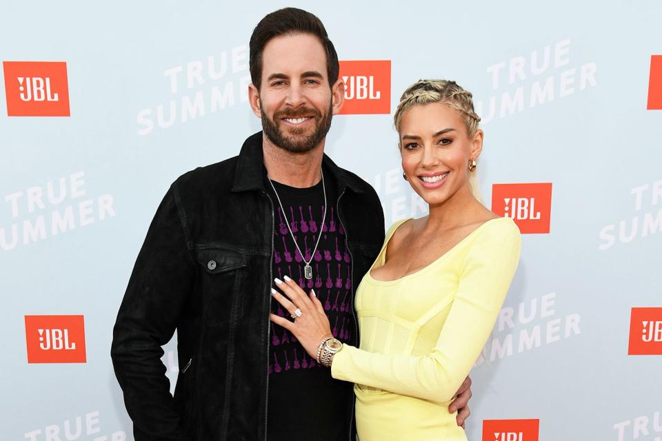 Tarek El Moussa and Heather Rae Young walk the red carpet at the JBL True Summer event.
