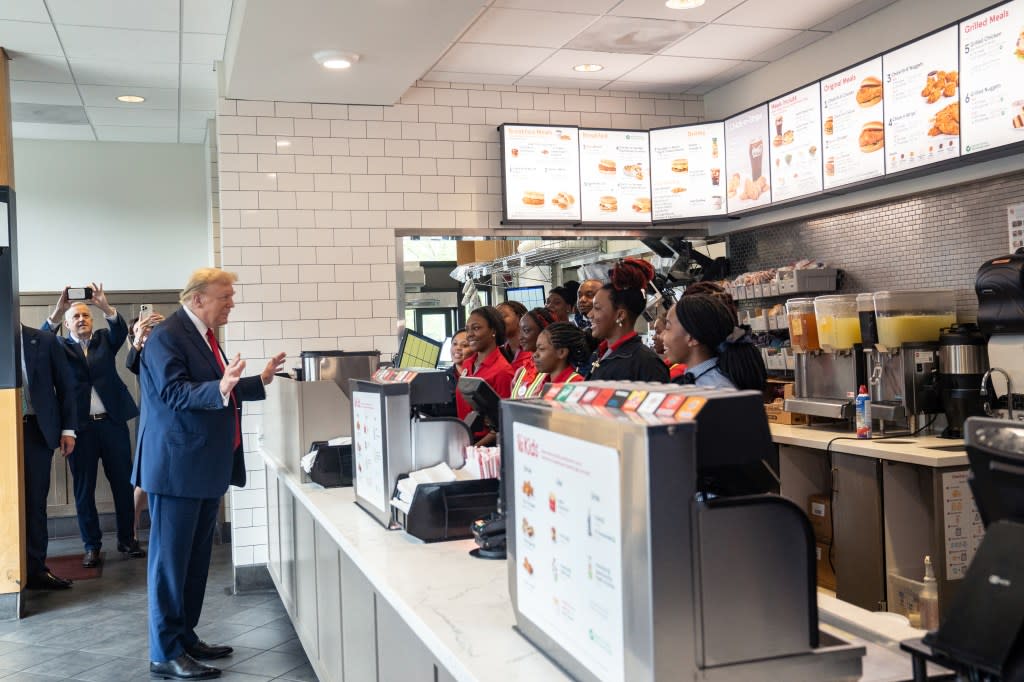 Former U.S. President Donald Trump meets employees during a visit to a Chick-fil-A restaurant on April 10, 2024, in Atlanta. (Photo by Megan Varner/Getty Images)