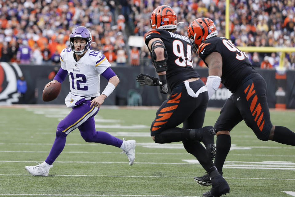 Minnesota Vikings quarterback Nick Mullens (12) rolls out near the end zone during the second half of an NFL football game against the Cincinnati Bengals, Saturday, Dec. 16, 2023, in Cincinnati. (AP Photo/Jay LaPrete)