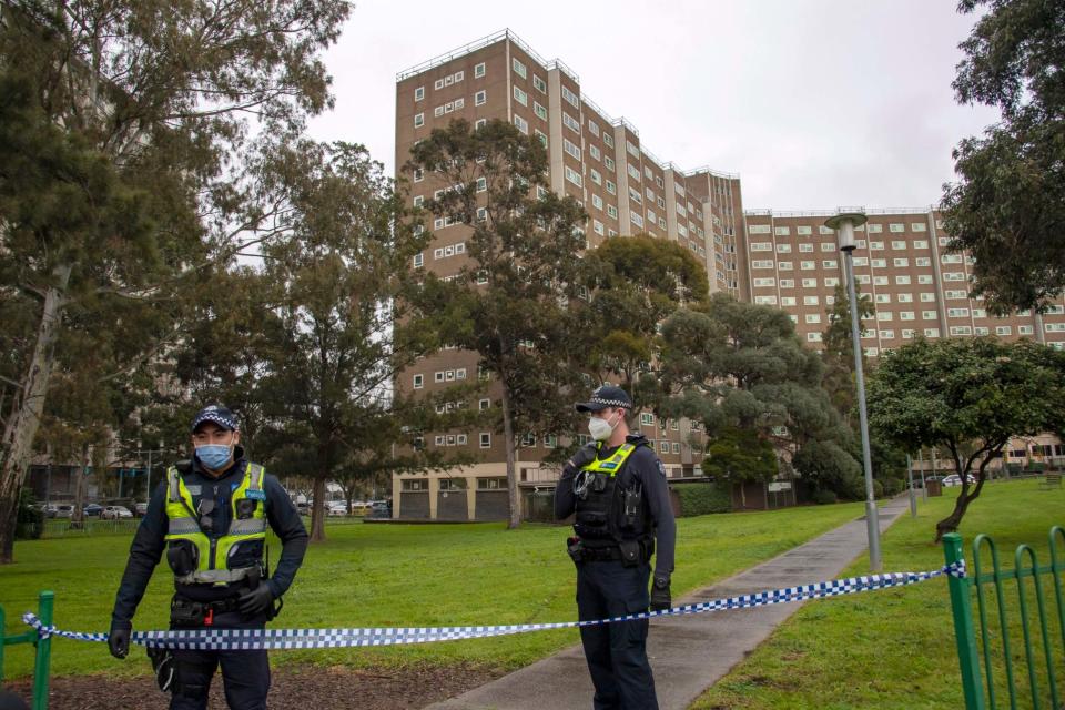 Police guard access to housing commission apartments under lockdown in Melbourne (AP)