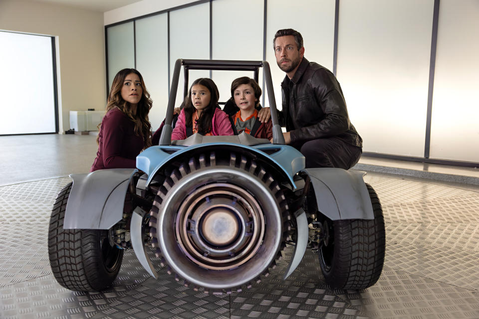 Gina Rodriguez as Nora Torrez, Everly Carganilla as Patty Torrez, Connor Esterson as Tony Torrez and Zachary Levi as Terrence Torrez in Spy Kids: Armageddon (Netflix)