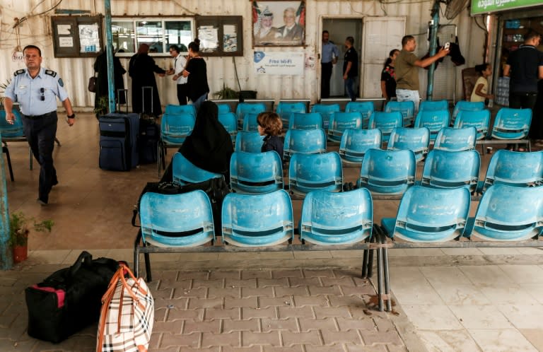 Palestinians wait at the Erez crossing with Israel near Beit Hanun in the northern Gaza Strip on August 27, 2018