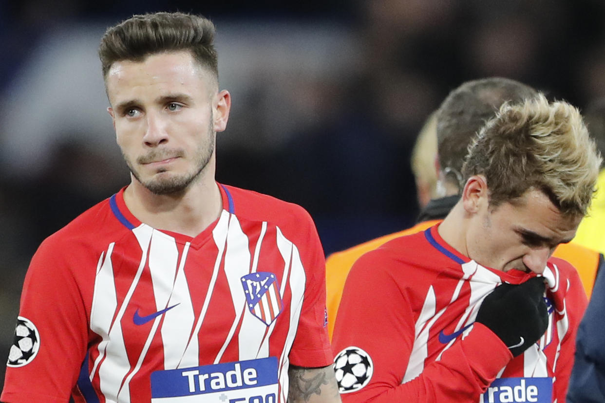 Atletico Madrid’s Saul Niguez, left, and Antoine Griezmann walk off the field dejectedly after drawing Chelsea. (AP)