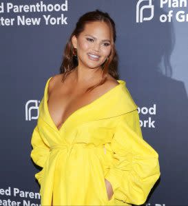 Chrissy Teigen Assures Critics That Her Daughter Is ‘Safe’ After Getting Called Out for Not Using Baby Carrier 'Right' Promo: Chrissy Teigen Responds to Critic