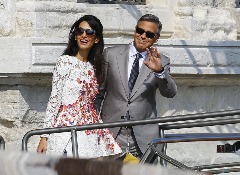 U.S. actor George Clooney and his wife Amal Alamuddin leave the seven-star hotel Aman Canal Grande Venice in Venice September 28, 2014. Clooney, the world's most famous bachelor, broke a vow to remain single on Saturday and married human rights lawyer Alamuddin during a weekend of lavish celebrations in Venice. The Italian city of gondolas and palazzi looked like Hollywood on the Adriatic as A-list guests cruised between luxury hotels for the extravaganza, billed as the party of the year even as details were kept largely secret.&nbsp;