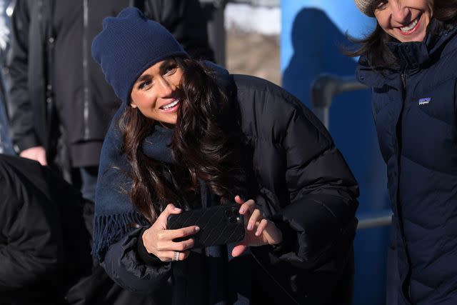 <p>Karwai Tang/WireImage</p> Meghan Markle films Prince Harry in Canada on Feb. 15, 2024