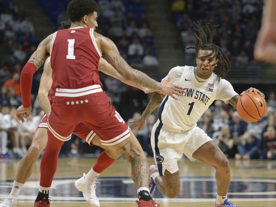 Penn State's Ace Baldwin Jr. (1) drives on Indiana's Kel'el Ware (1) during the first half of an NCAA college basketball game Saturday Feb. 24, 2024, in State College, Pa. (AP Photo/Gary M. Baranec)