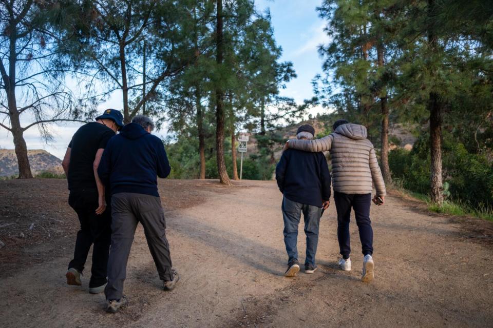 Pete Teti, second from right, hikes with his buddies in Griffith Park early on Thanksgiving morning.