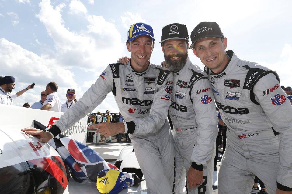 Mazda Motorsports DPi drivers, from left, Harry Tincknell, Jonathan Bomarito and Oliver Jarvis celebrate in victory lane after winning the Sahlen's Six Hours of The Glen on June 27, 2021 at Watkins Glen International.