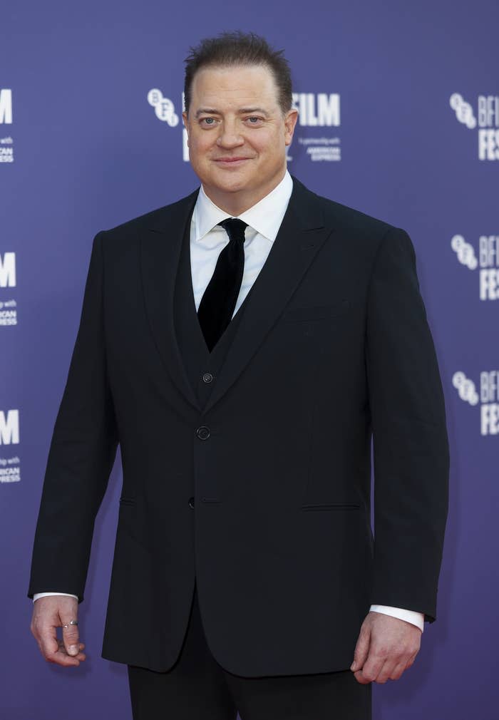 Brendan at a red carpet event wearing a suit and tie