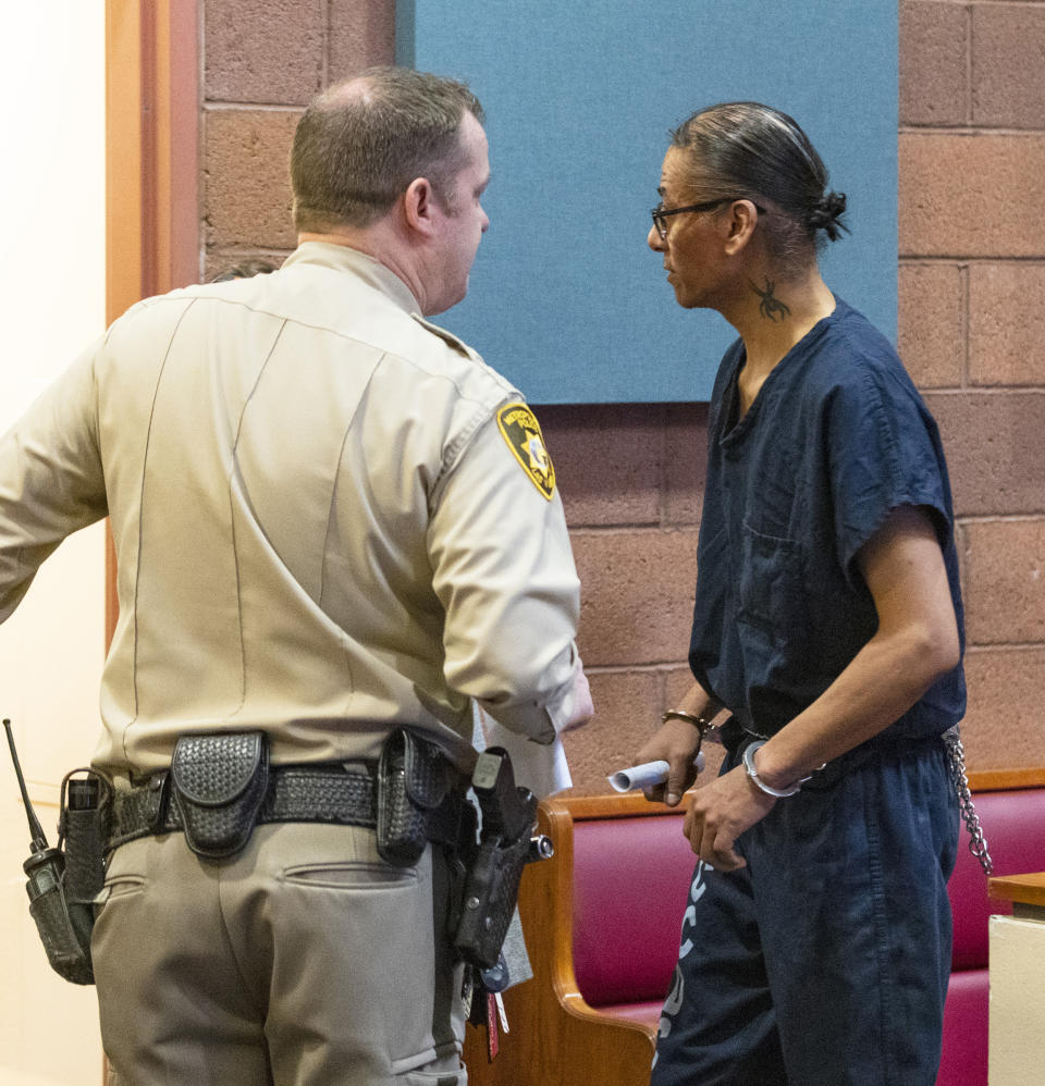 Former actor Nathan Lee Chasing His Horse, right, also known as Nathan Chasing Horse, is lead out of the courtroom after his bail hearing at North Las Vegas Justice Court, Wednesday, Feb. 8, 2023. A judge on Wednesday set bail at $300,000 for the former “Dances With Wolves” actor charged in Nevada with sexually abusing and trafficking Indigenous women and girls. (Bizuayehu Tesfay/Las Vegas Review-Journal via AP)