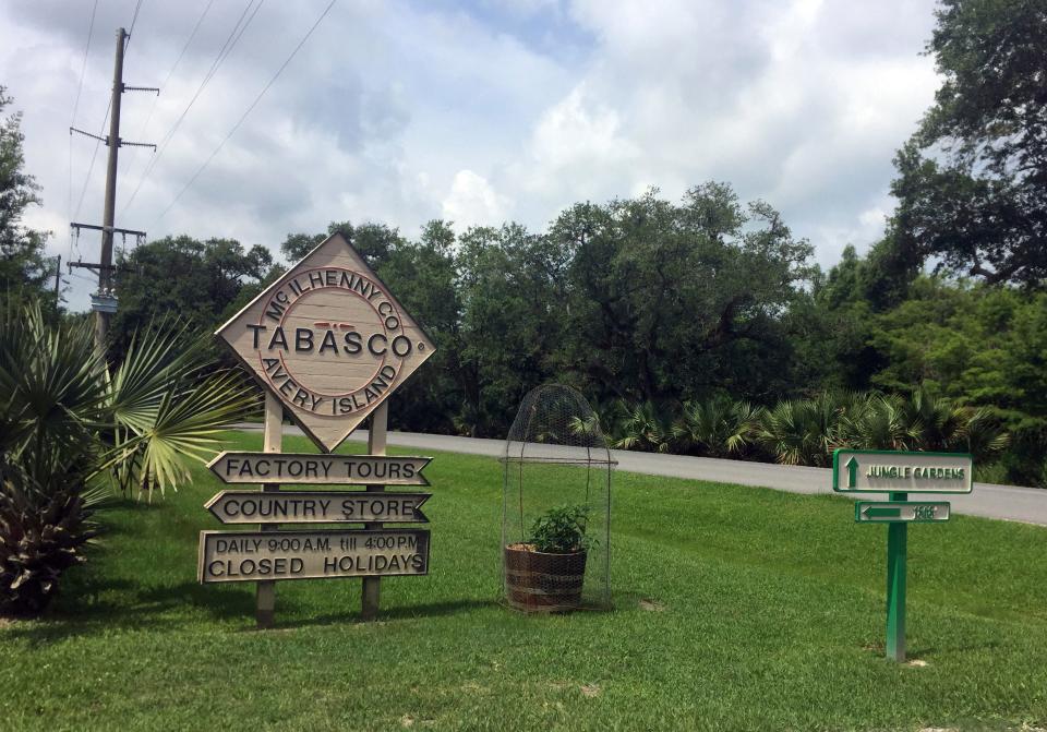 A sign directing visitors to attractions on Avery Island in Louisiana on June 4, 2018. Louisiana's Avery Island, a salt dome and the birthplace of Tabasco pepper sauce, was listed on the National Register of Historic Places in 2018.