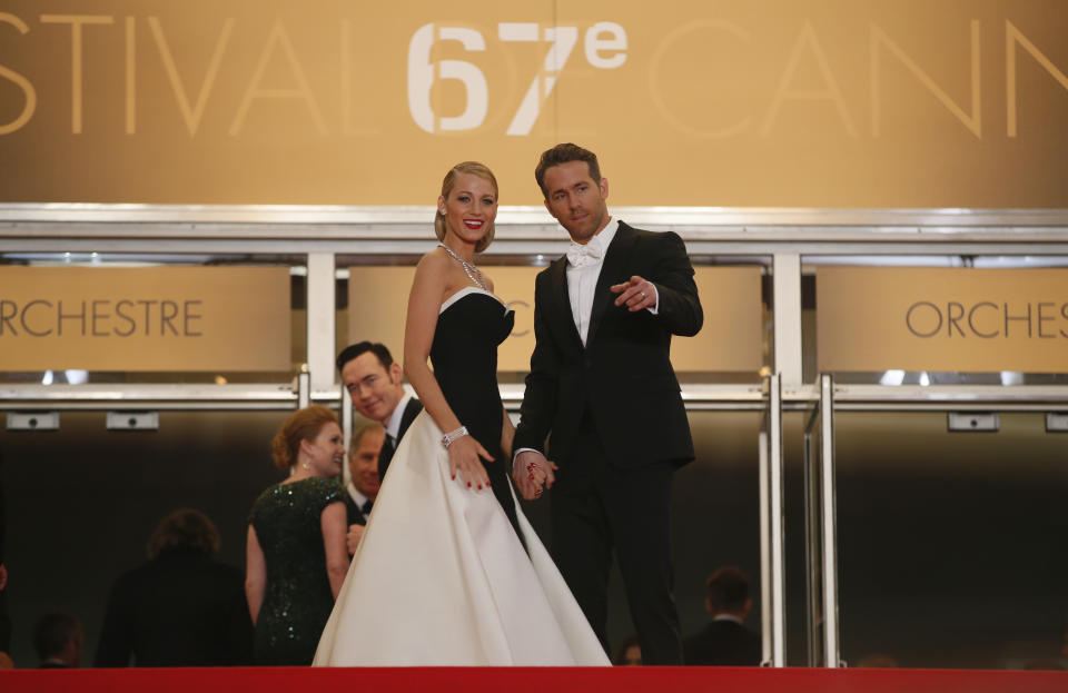 Actor Ryan Reynolds, right, and his wife, actress Blake Lively arrive for the screening of Captives at the 67th international film festival, Cannes, southern France, Friday, May 16, 2014. (AP Photo/Alastair Grant)