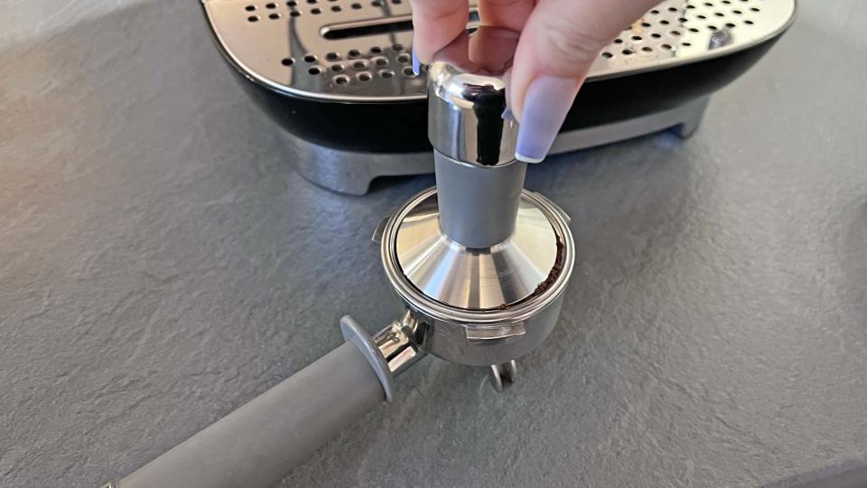 Coffee grounds being tamped for espresso