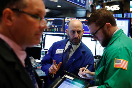 Traders work on the floor of the New York Stock Exchange shortly after the opening bell in New York, U.S., February 21, 2018. REUTERS/Lucas Jackson