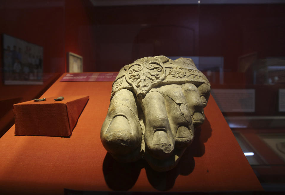 In this Saturday, Aug. 17, 2019 photo, the foot of a giant Zeus statue is on display at the Afghan National Museum of Afghanistan in Kabul, Afghanistan. The Taliban fighters arrived with hammers and hatred. What they left behind is laid out on tables at the National Museum of Afghanistan, 18 years later. Museum workers in Kabul have been trying to fit them together again as a nervous country waits for the Taliban and the U.S. to reach a deal on ending America’s longest war. (AP Photo/Rafiq Maqbool)