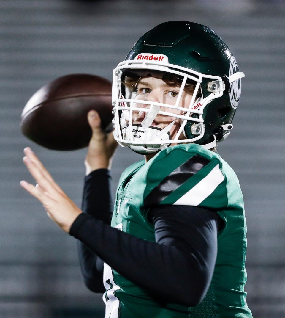 Trinity quarterback Zane Johnson warmed up before the Rocks faced Frederick Douglass in a Class 6A state semifinal on Nov. 24.