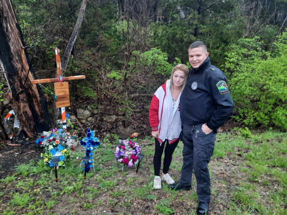 Cecilia Williams and Cpl. Cody James Umfress of the Byrnes Mill Police Department are pictured at the site of the crash that killed Williams' son Cordell, his fiancée Lacey Newton and their son Cordell II. Umfress was among the first responders at the head-on collision police say was caused by drunk driving.