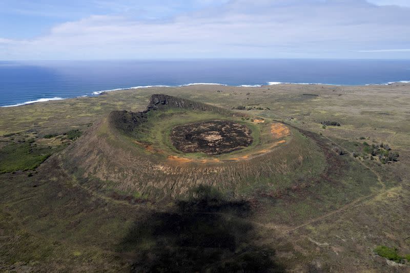 FILE PHOTO: Burned Moai statues on Easter Island lay bare the scars of land grabs