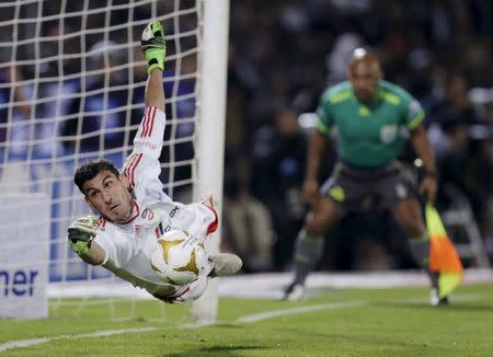 FILE PHOTO: Football Soccer - Pumas v Tigres - The second leg of their Mexican first division final soccer match - Olimpico Universitario stadium, in Mexico City, Mexico - 13/12/15 Tigres's goalkeeper Nahuel Guzman saves a penalty shootout of Pumas REUTERS/Henry Romero