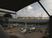 A Delhi metro train arrives at a station on the outskirts of New Delhi, India, Monday, Sept. 7, 2020. India's coronavirus cases are now the second-highest in the world and only behind the United States, as the caseload crosses Brazil on a day when urban metro trains partially resume service in the capital New Delhi and other states. (AP Photo/Manish Swarup)