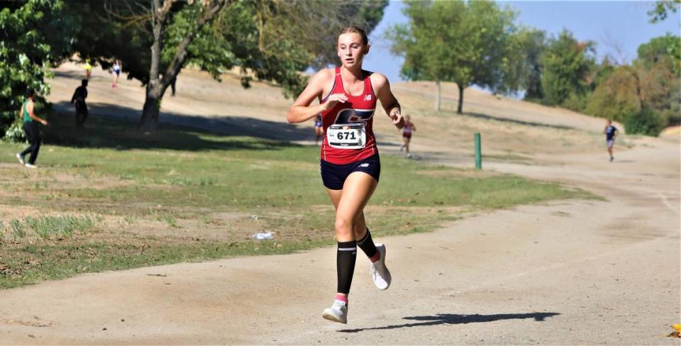 Sanger High sophomore Kinsley Allan took first in the large school varsity girls race at the 20th Golden Eagle Invitational at Woodward Park in Fresno. Her time was 19:57.82.