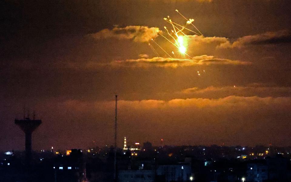 Israeli Iron Dome missiles intercept incoming missiles fired from the Gaza Strip above the Palestinian enclave, on April 21, 2022.