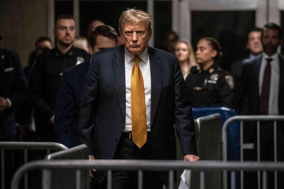 Donald Trump appears in a criminal courthouse in Manhattan for his hush money trial on May 21. (AP)