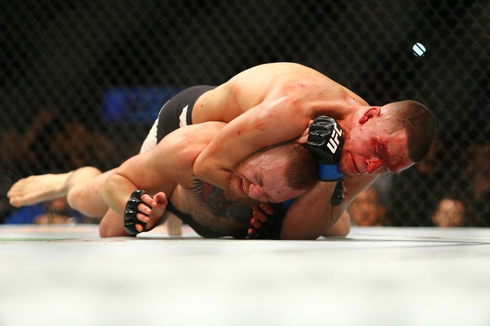 Nate Diaz applies a choke hold to win by submission against Conor McGregor during UFC 196 at the MGM Grand Garden Arena on March 5, 2016 in Las Vegas. (Getty Images)