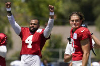 Dallas Cowboys quarterback Dak Prescott (4) and Los Angeles Chargers quarterback Justin Herbert (10) participate in drills during a combined NFL practice at the Los Angeles Rams' practice facility in Costa Mesa, Calif. Thursday, Aug. 18, 2022. (AP Photo/Ashley Landis)